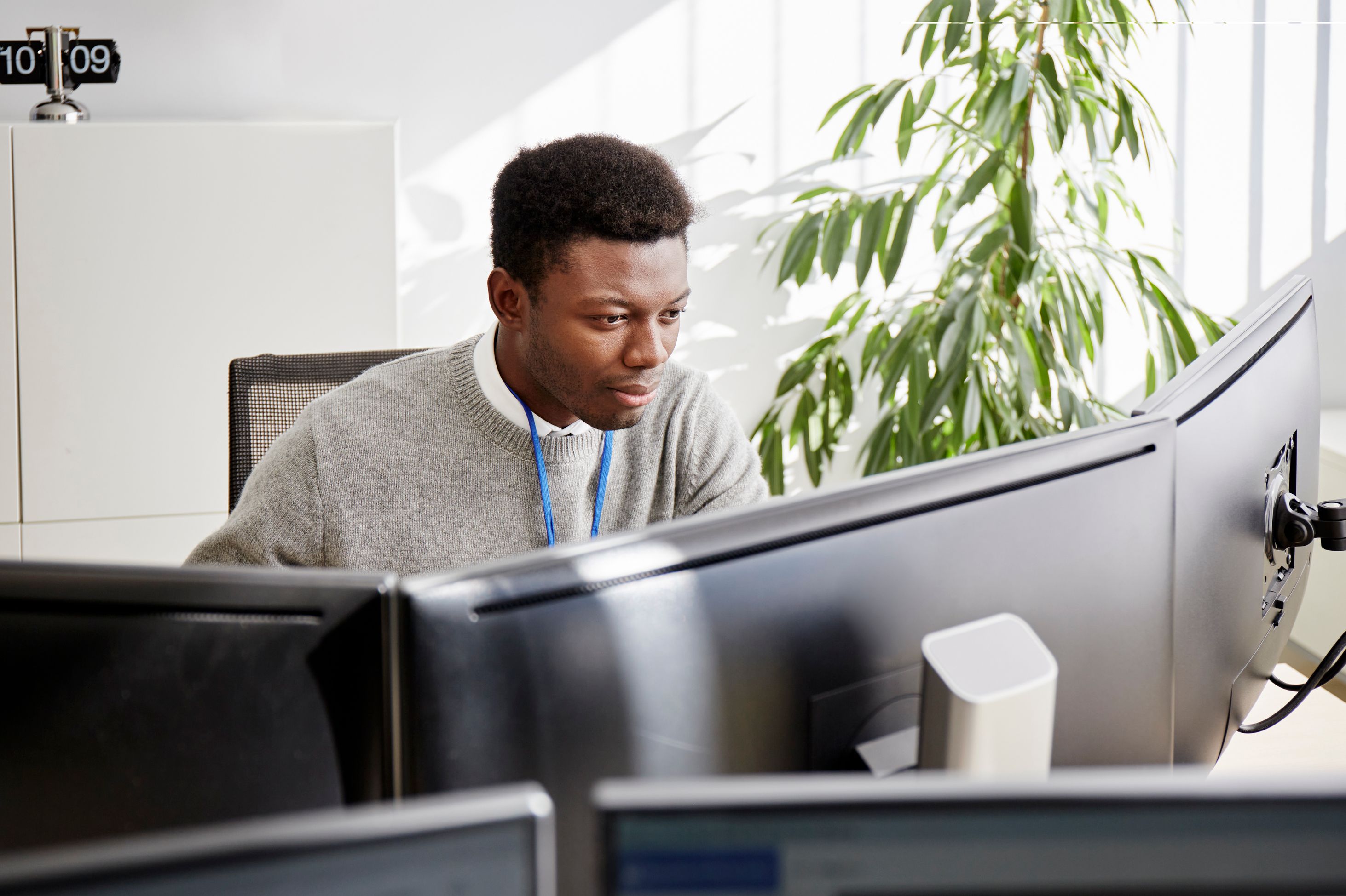 Two men fixing a car