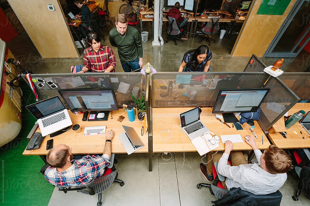 people working at desks from overhead