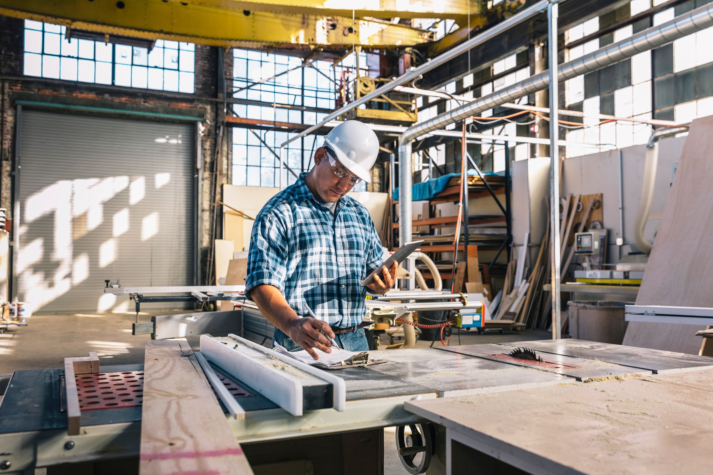 Man in hard hat working in warehouse