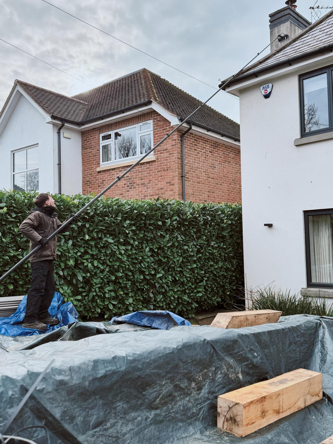 A finished roof after careful treatment, with reduced black streaking, clear gutters and a bright, well-kept exterior below