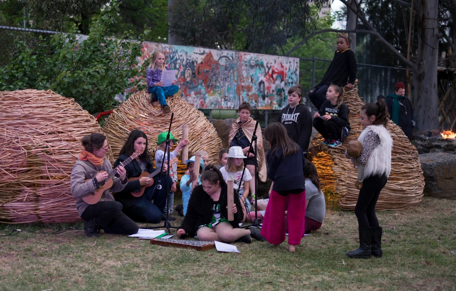 A group of young people rehearsing around large stick domes as part of Chamber Made's The Venny Imagine a Place 2017