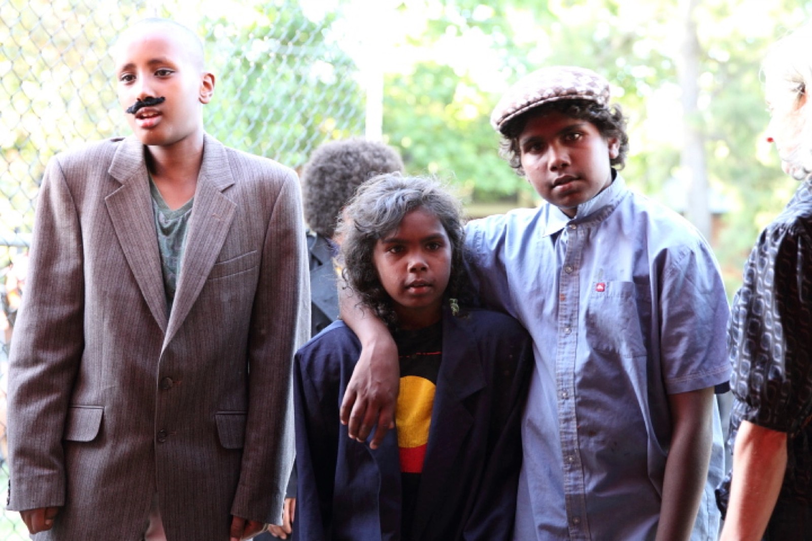 Three young people two with arms draped as part of Chamber Made's The Venny Project 2012-2014