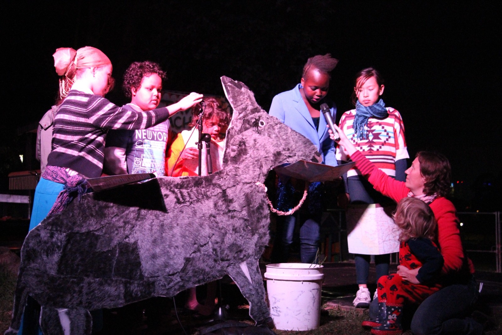 Children performing around a papier mache animal as part of Chamber Made's The Venny Project 2012-2014