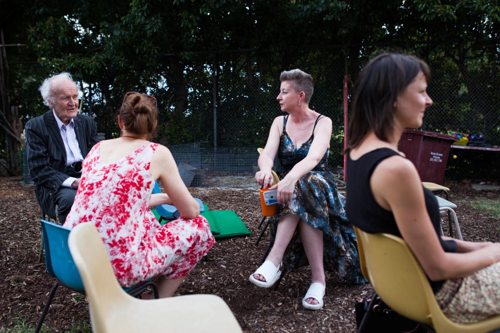 Four people on outdoor chairs in conversation as part of The Chamber Made Venny Celebration 2018