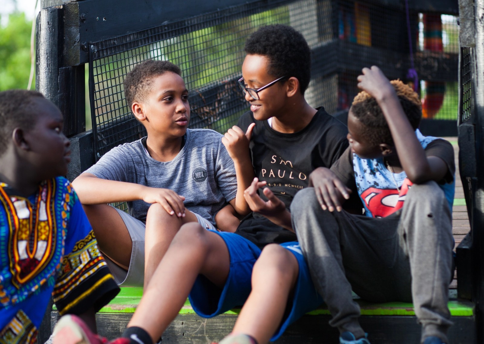 Four boys sitting together talking as part of The Chamber Made Venny Celebration 2018