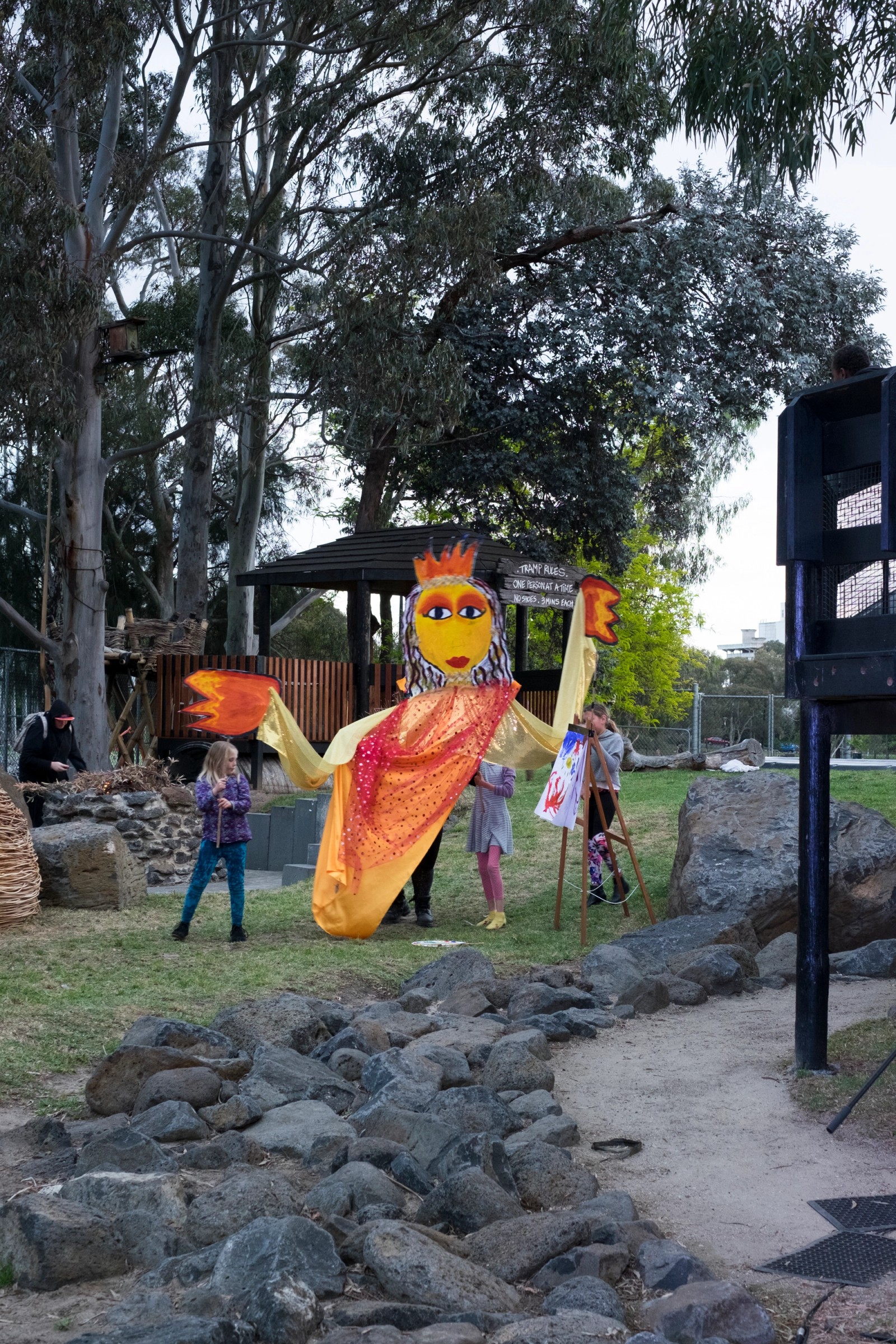 Young people operate a large orange queen puppet as part of Chamber Made's The Venny Imagine a Place 2017