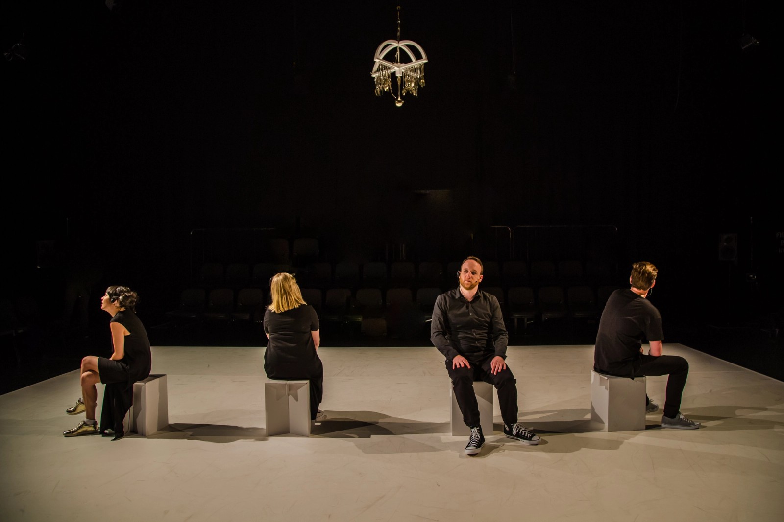 Four performers on white boxes  as part of Permission to Speak by Chamber Made