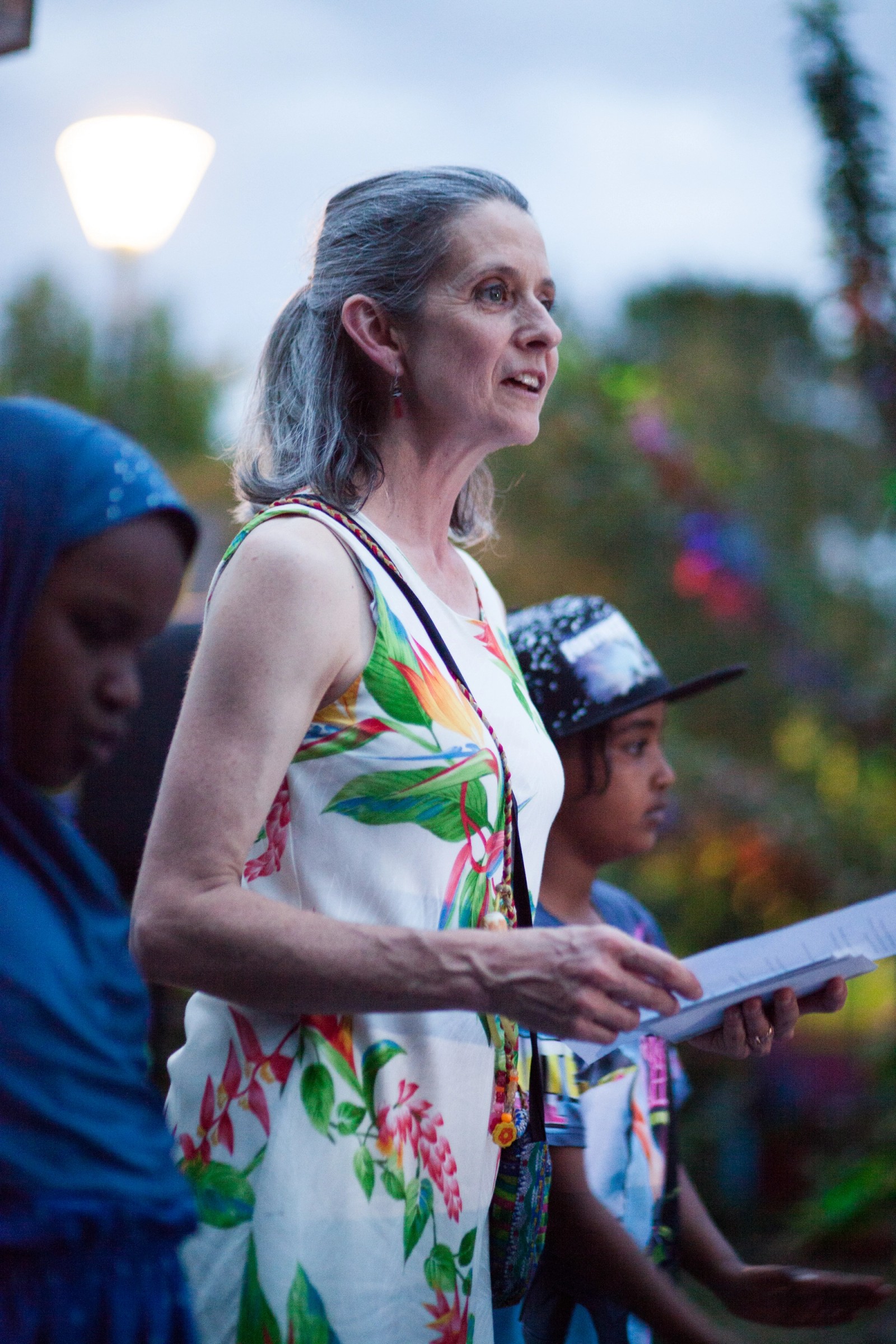 A woman reads an address with two children next to her as part of The Chamber Made Venny Celebration 2018