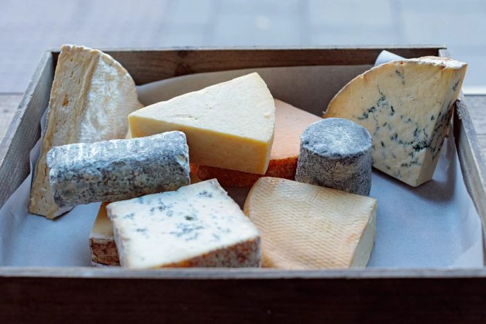 Cheeses in a wooden tray