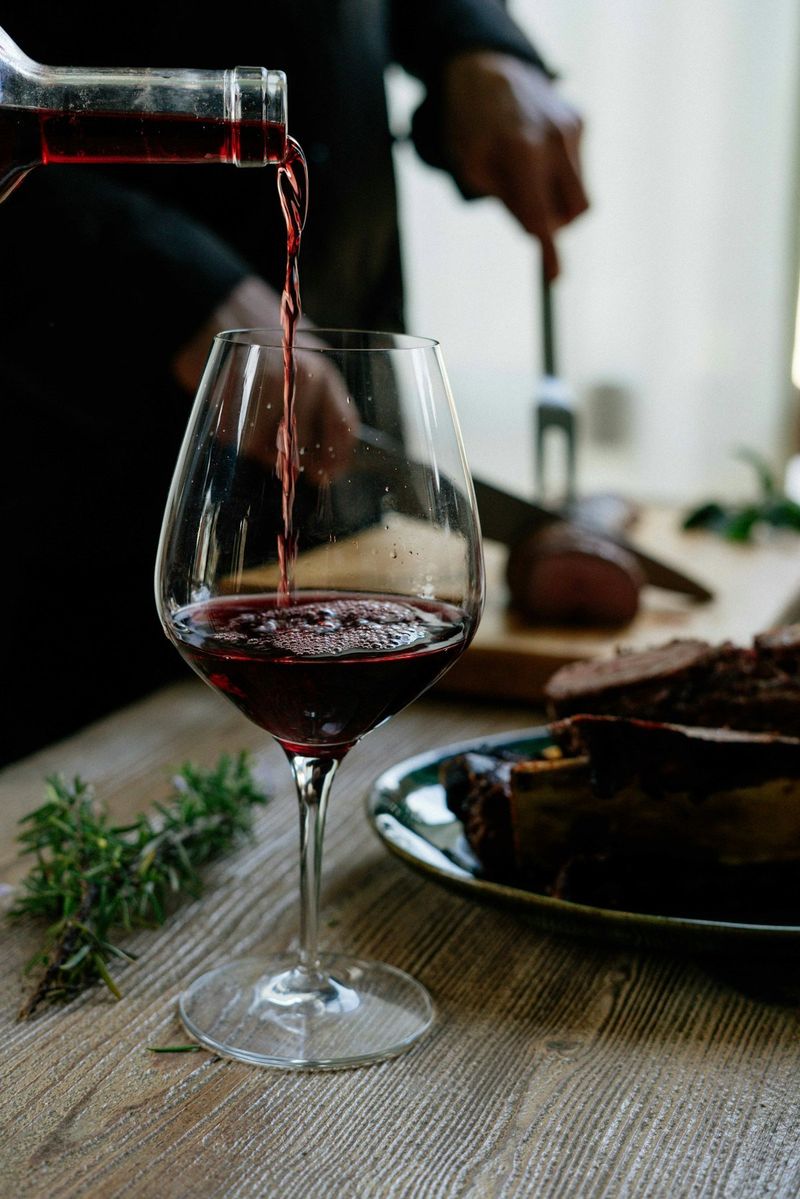 Pouring a glass of red wine