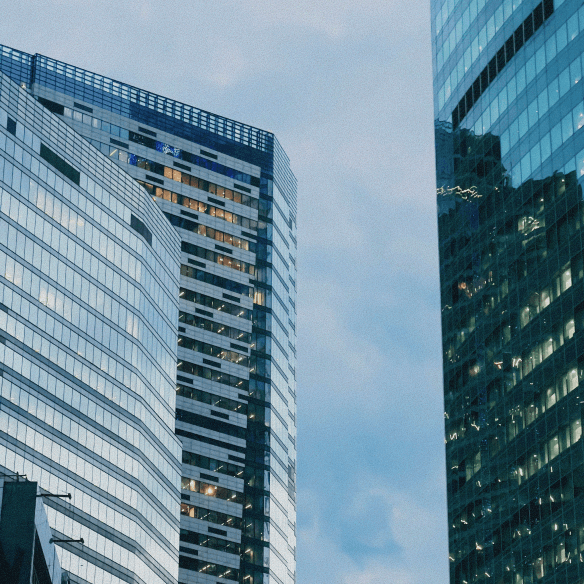 buildings against cloudy sky