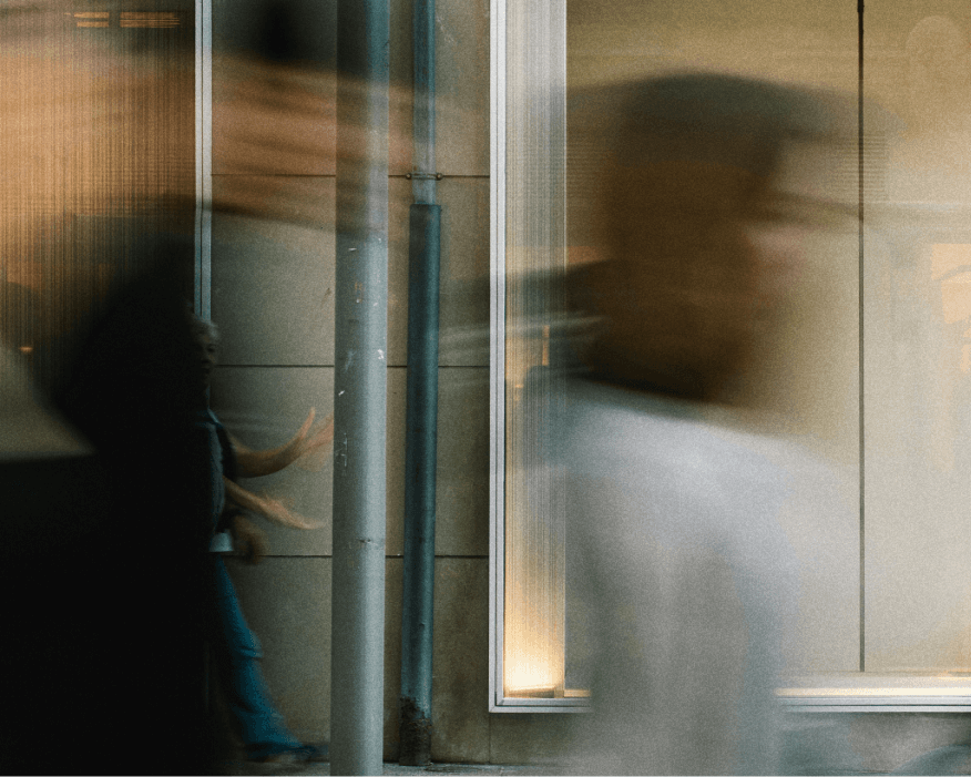 action shot of someone leaving a building