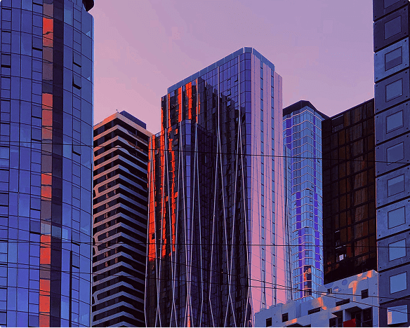 buildings over pink blue sky