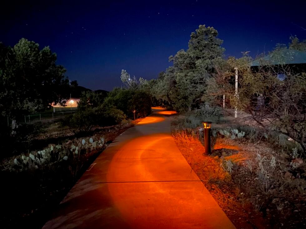 FLT's SCL2 solar luminaires and PLB solar bollards provide parking lot lighting and pathway lighting