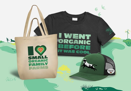 A postcard, water bottle, and hat with Organic Valley branding