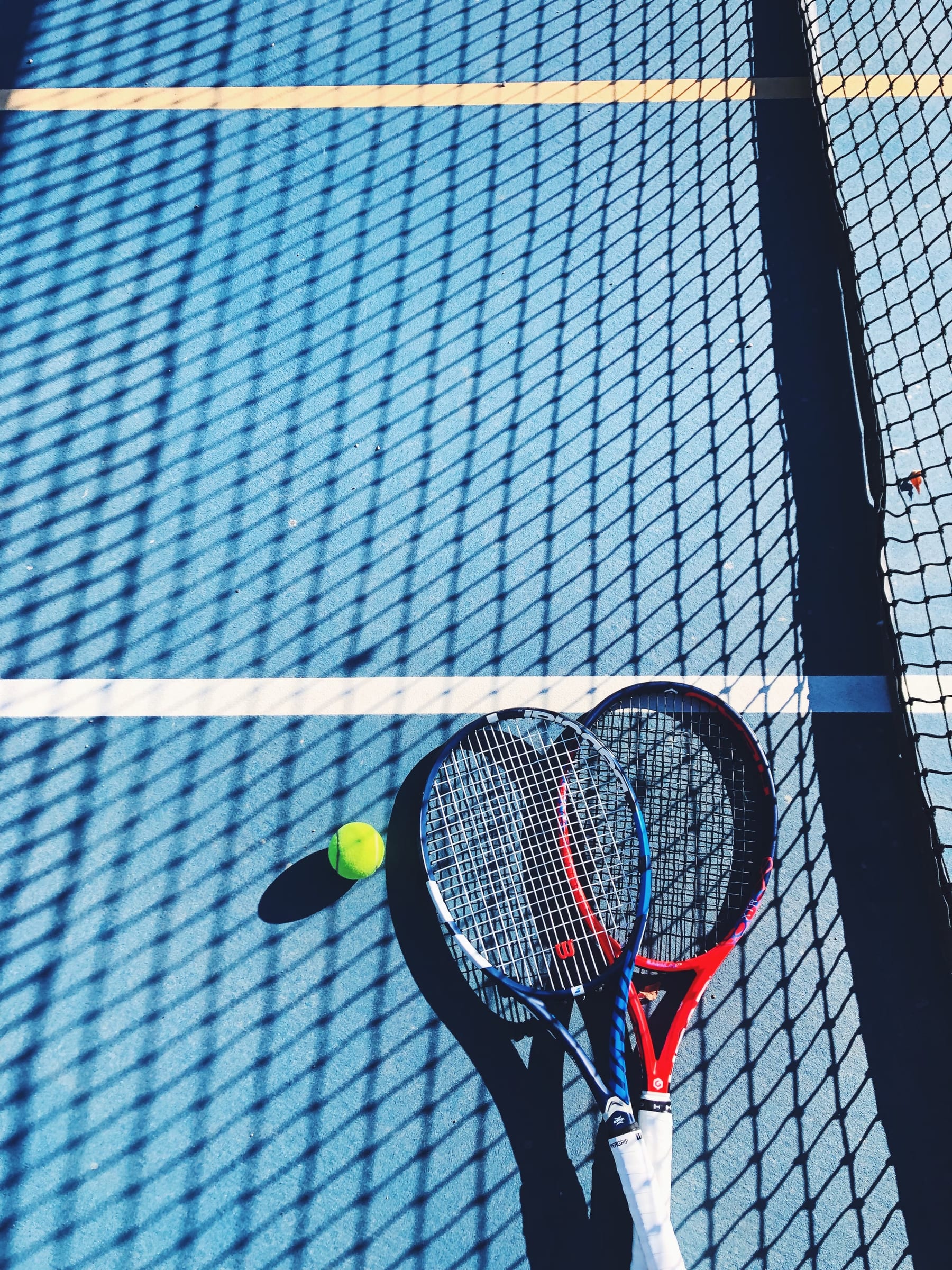 Rackets on a blue court