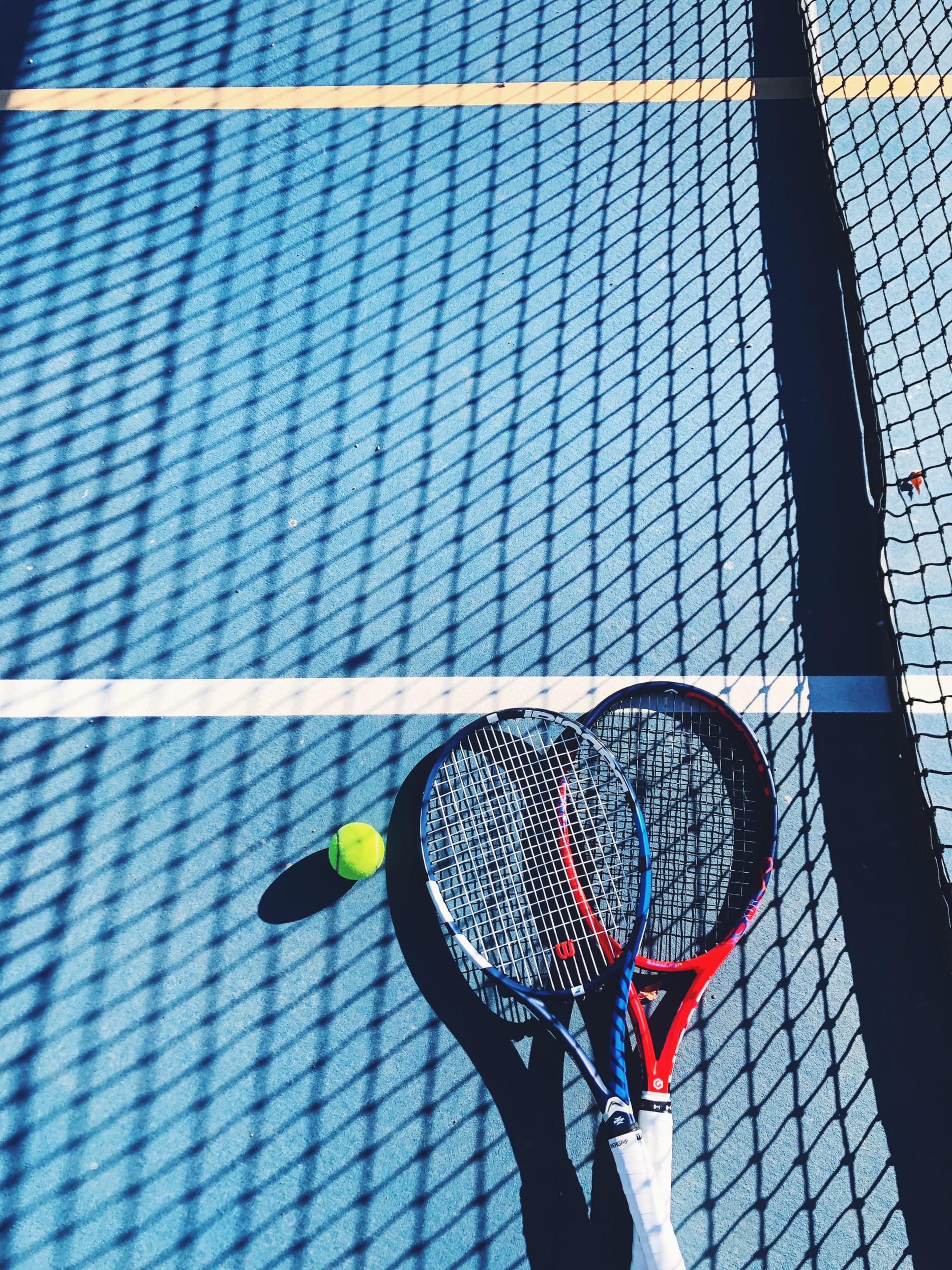 Rackets on a blue court