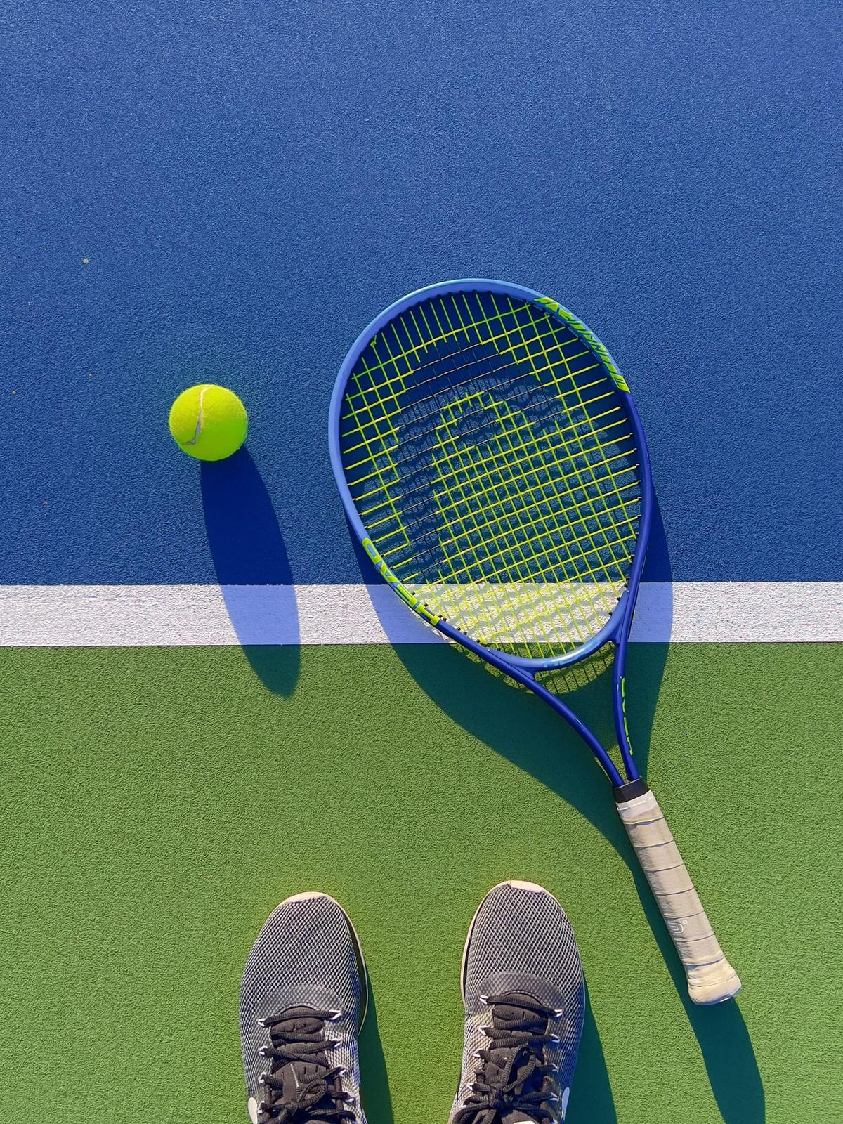 Racket with a fresh overgrip