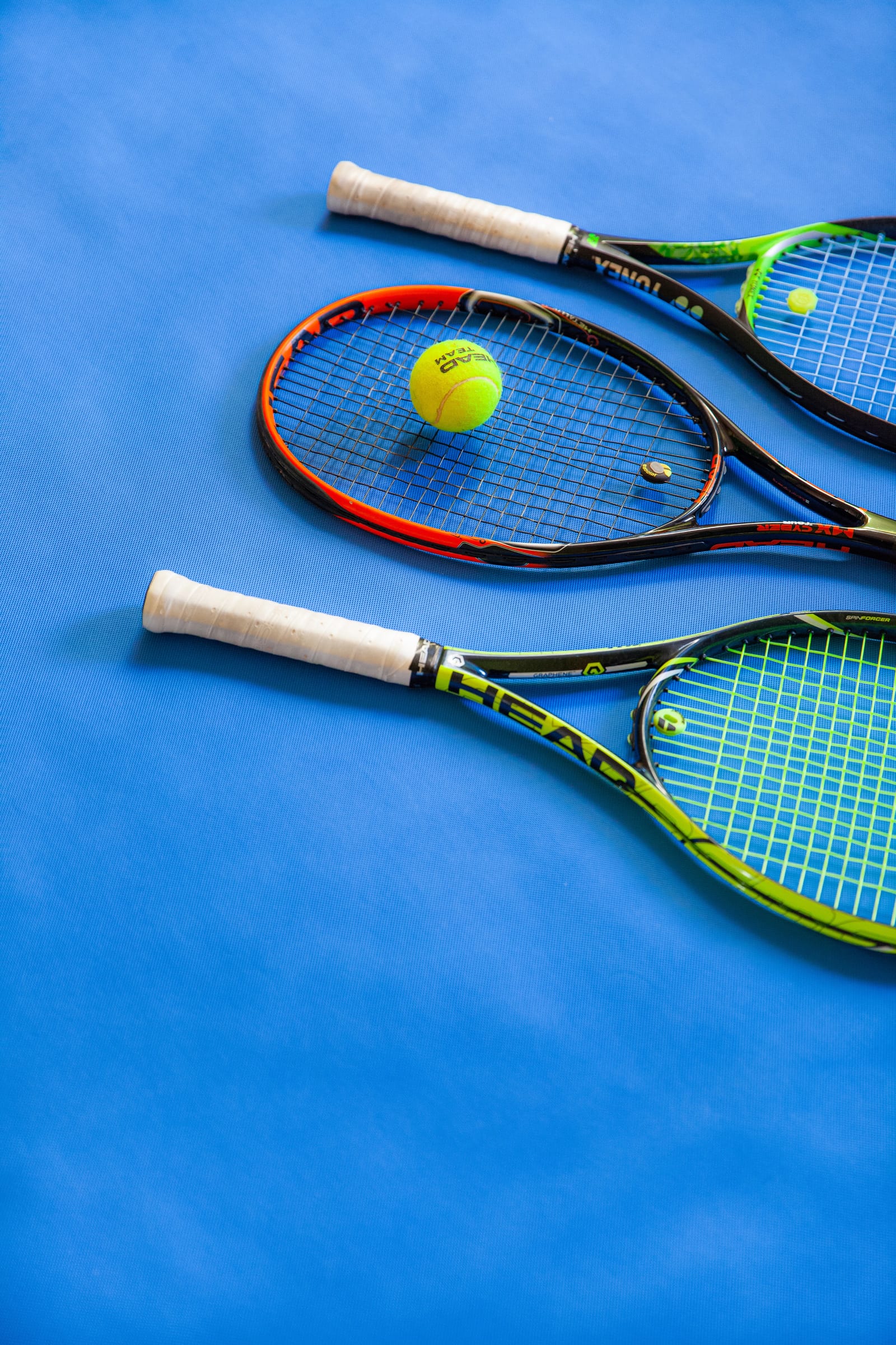 Rackets on a blue court