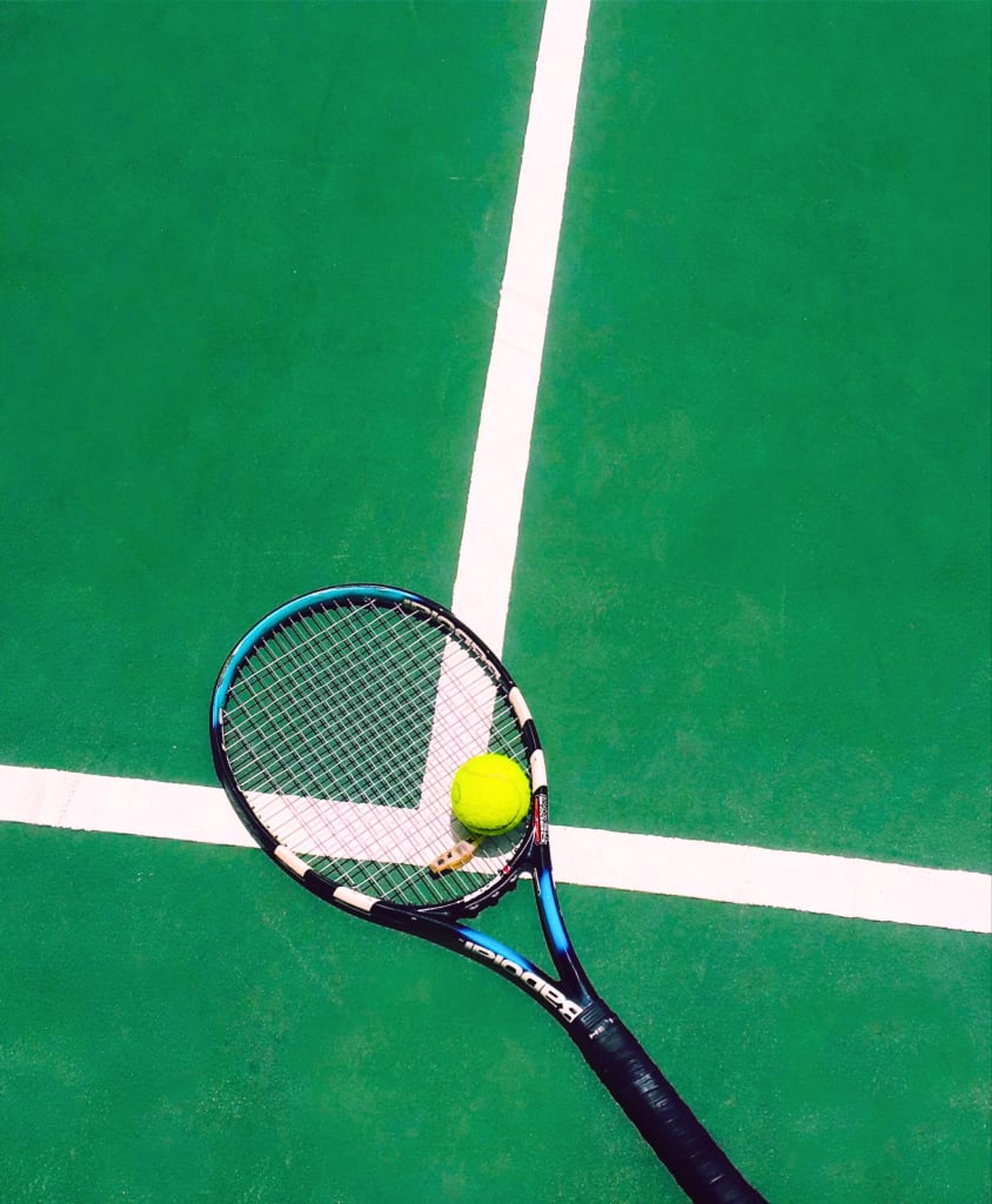 Racket on a green court