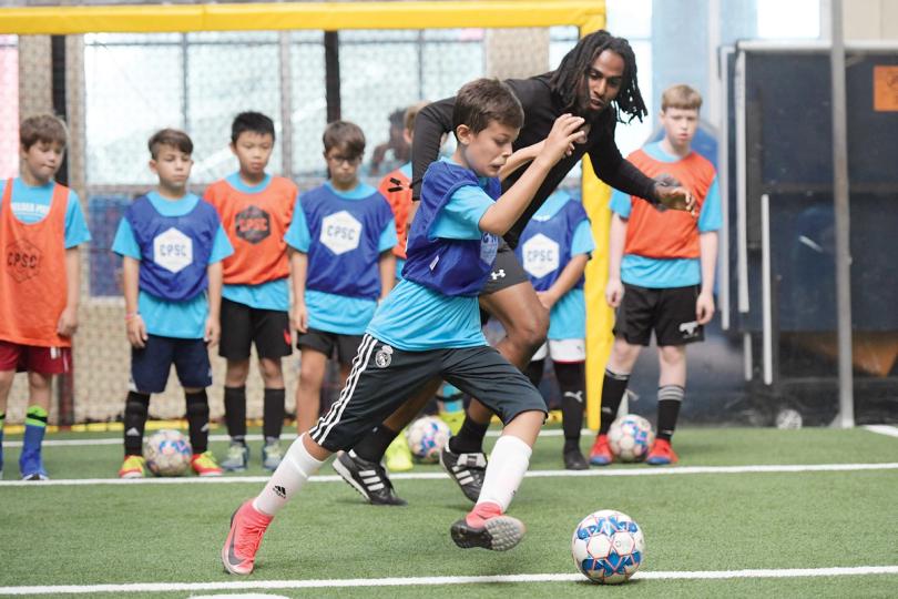 Boy playing soccer