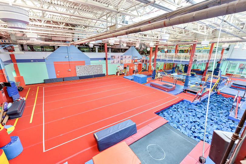 Field House Chelsea Gymnastics Center with spring floors, balance beams, and more