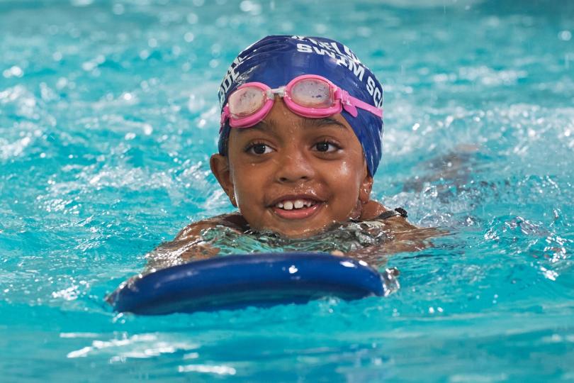 Kid learning to swim