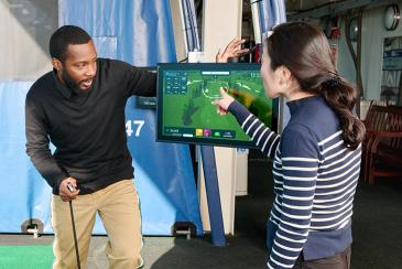 Golfers checking stats