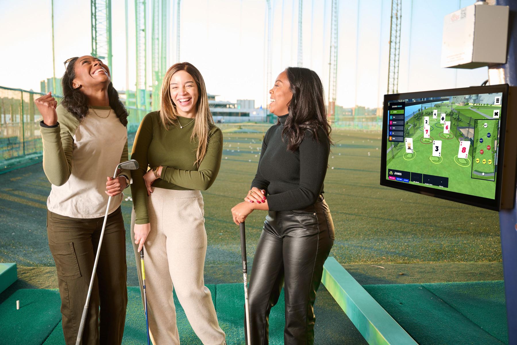 Women having fun playing golf