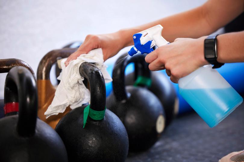 Wiping down kettlebells