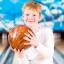 Kid holding a bowling ball