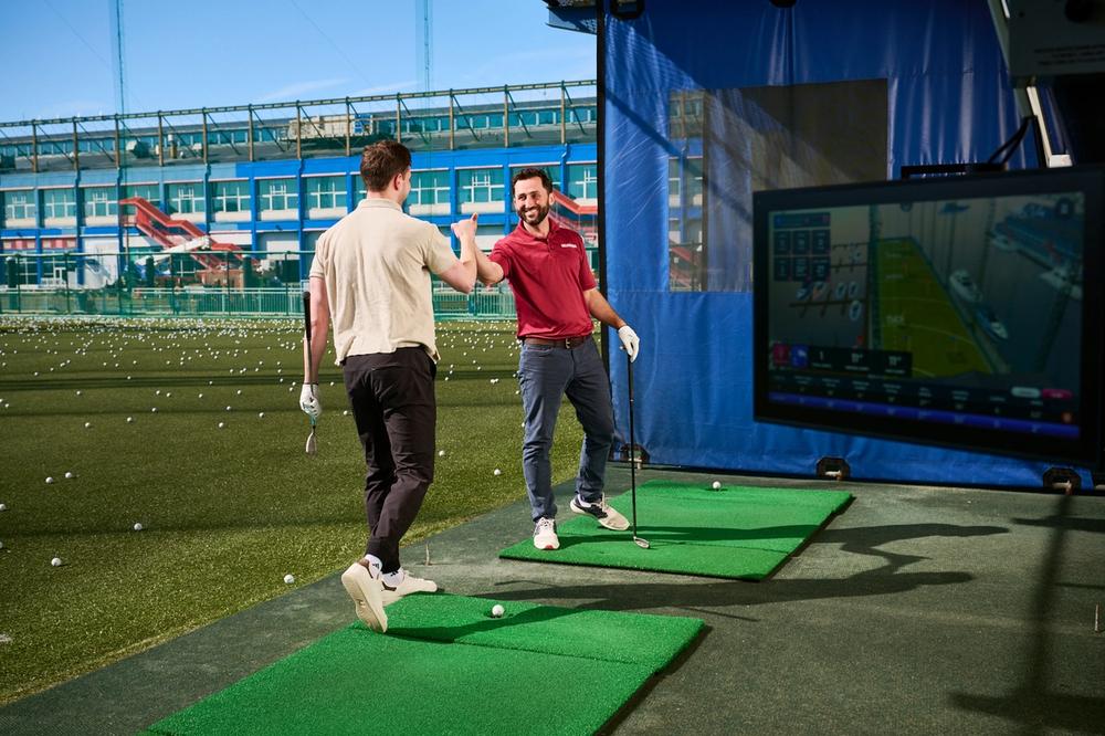Guys playing golf 