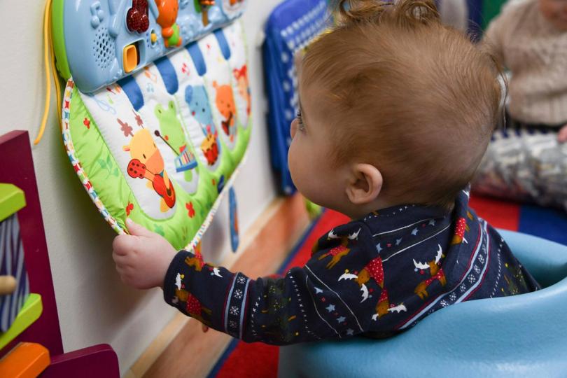 Kid exploring toys