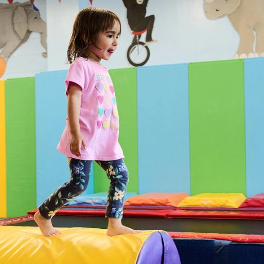 Girl playing in the toddler gym