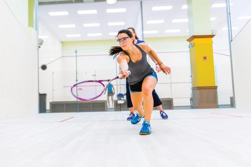 Woman playing squash