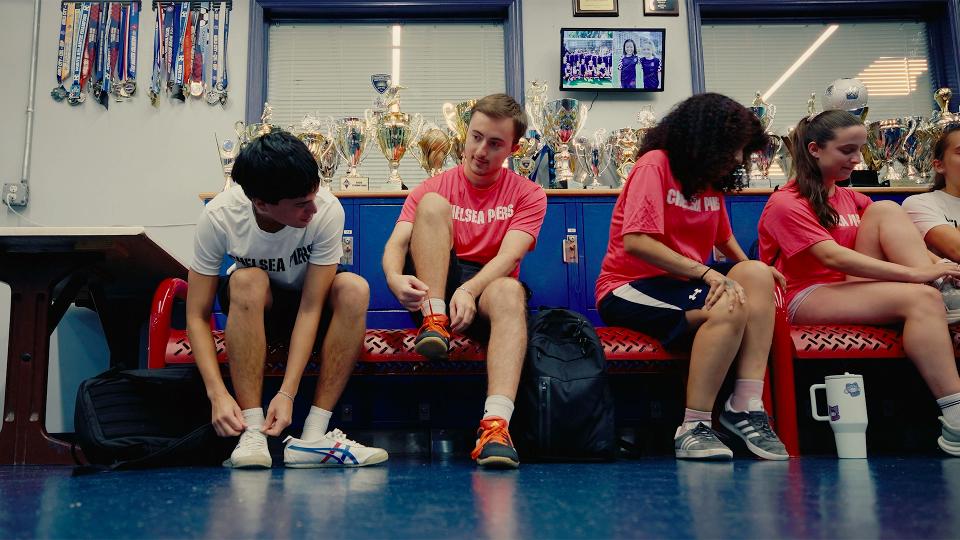 soccer players putting on cleats