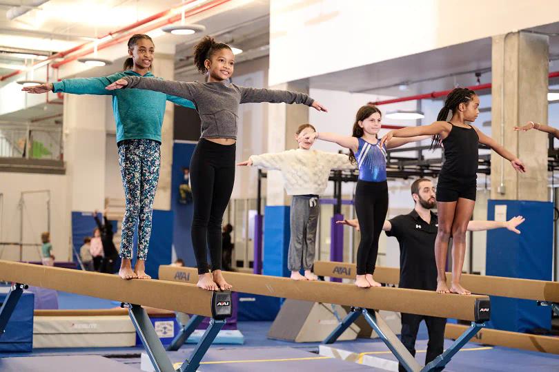 Gymnasts on a balance beam