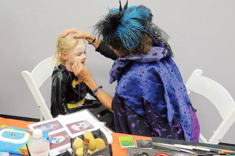 Face painting a kid