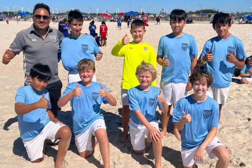 Soccer players at the beach