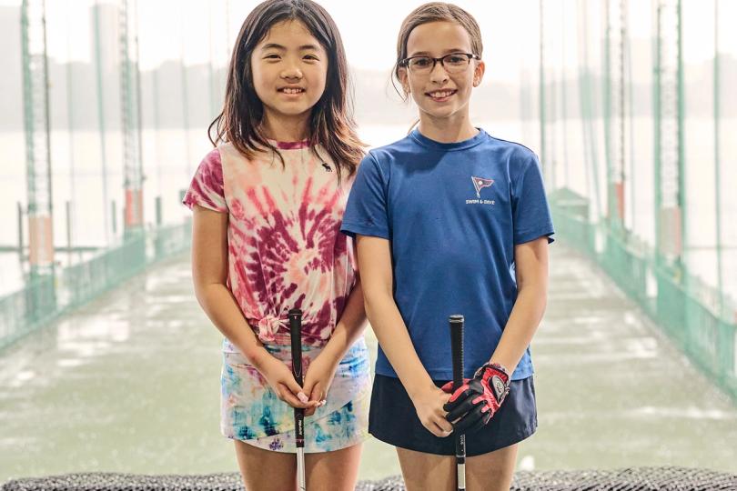 Girls with their golf clubs