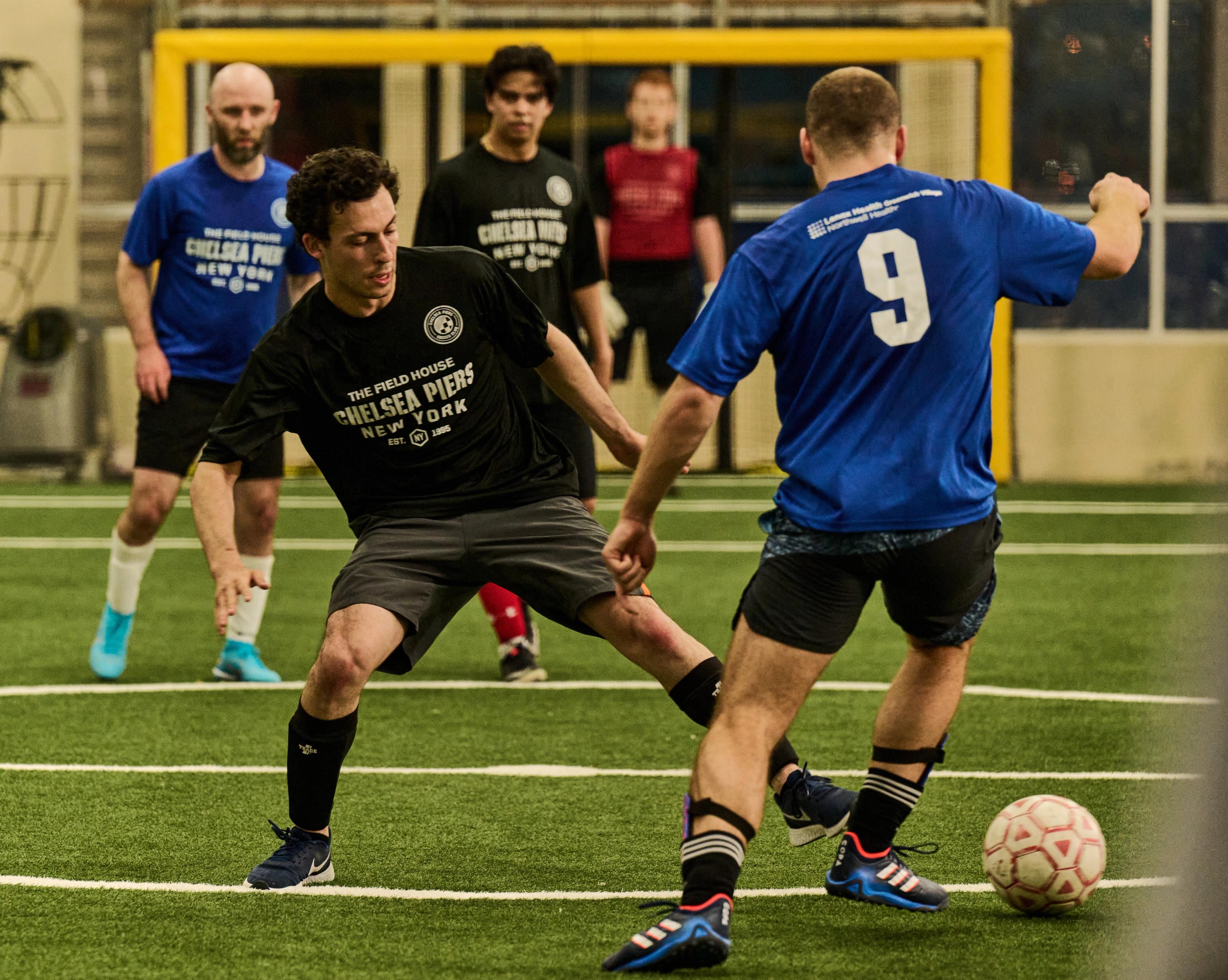Two soccer players competing at Field House Chelsea Piers