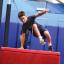 kid jumping over barrier