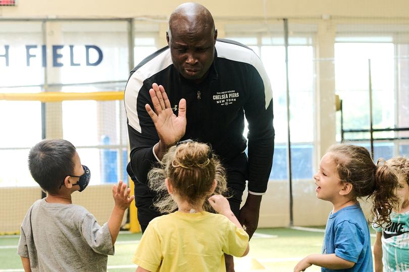 Coach giving their gymnastics student a high five