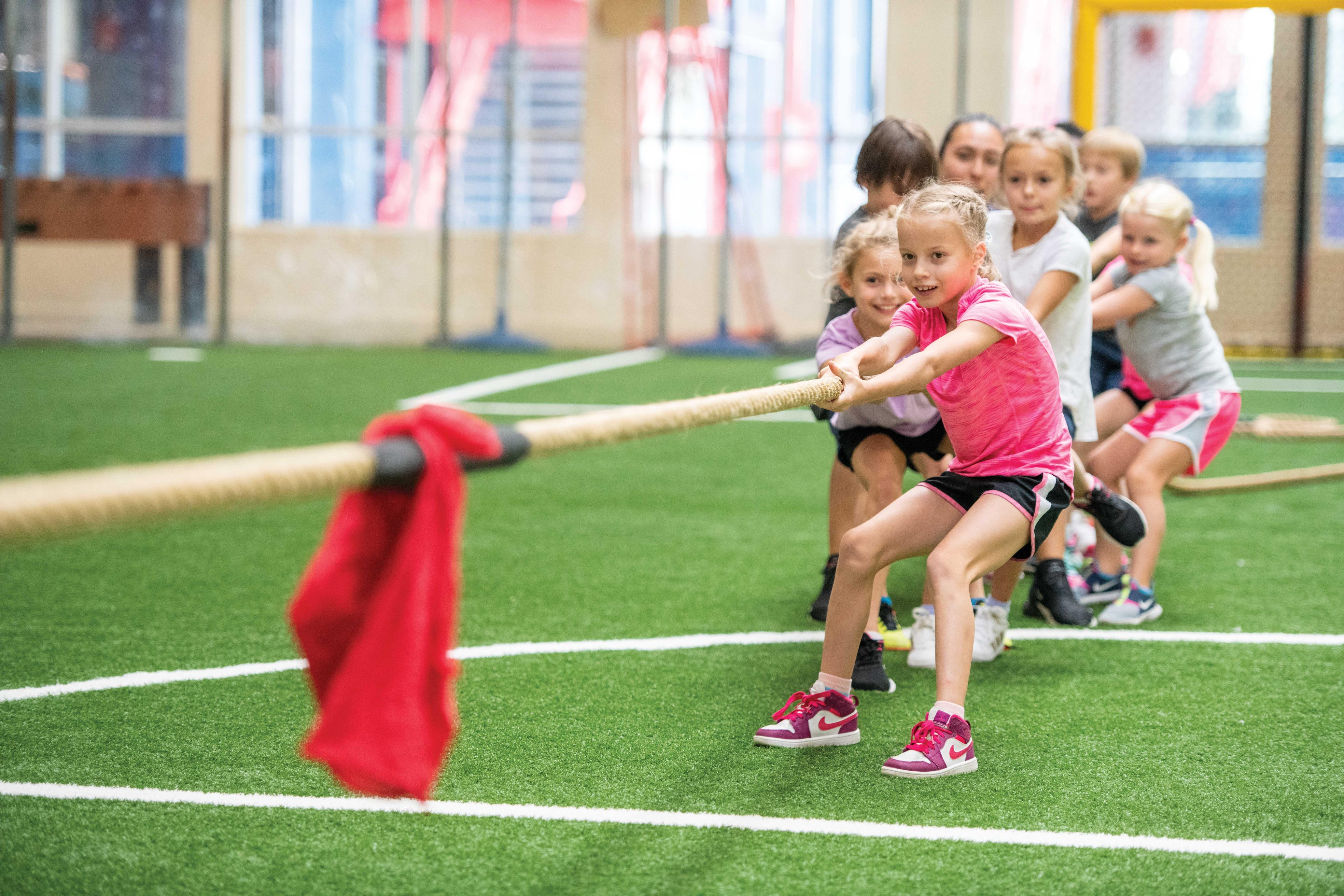 Happy kids playing tug of war