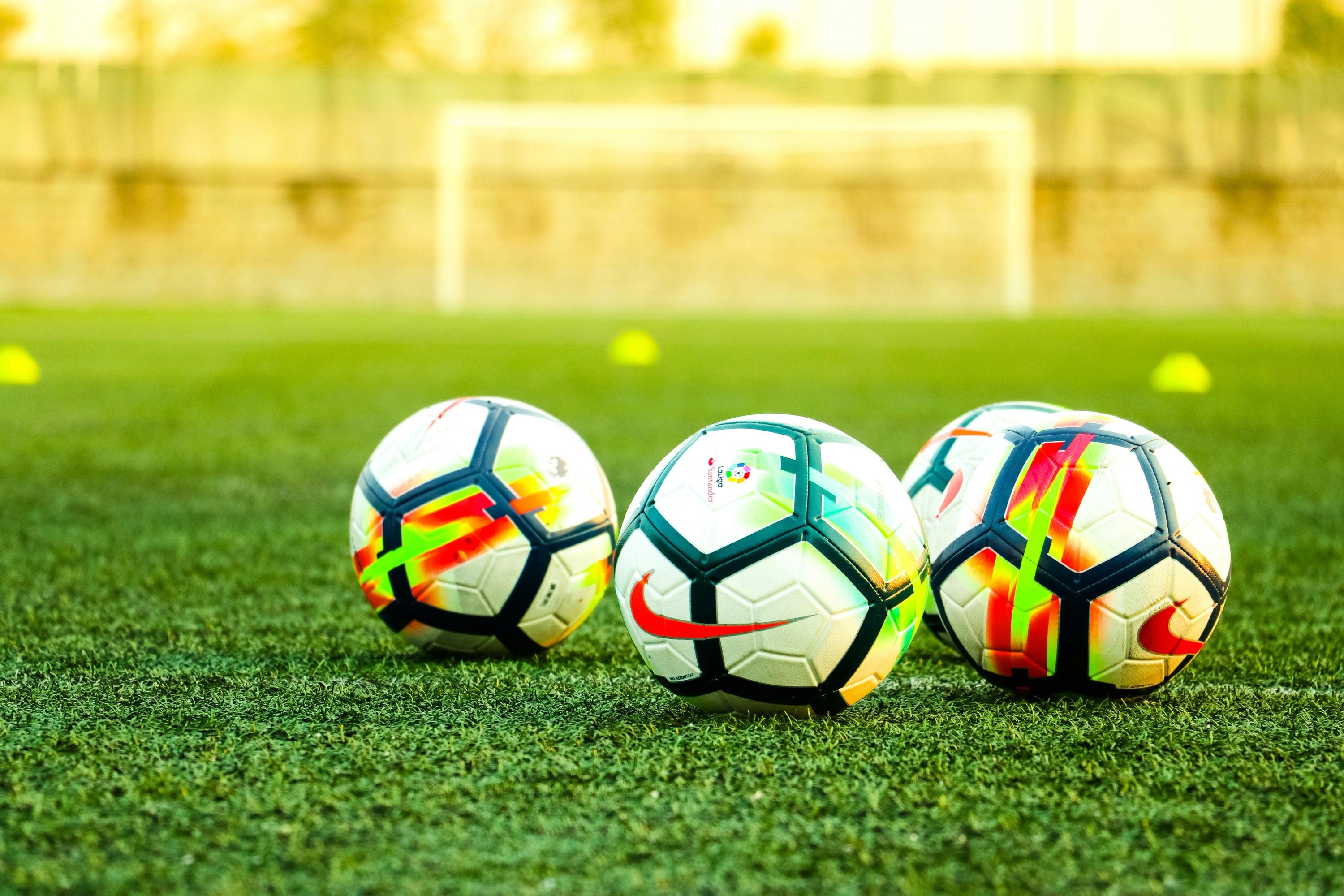 Soccer balls on turf