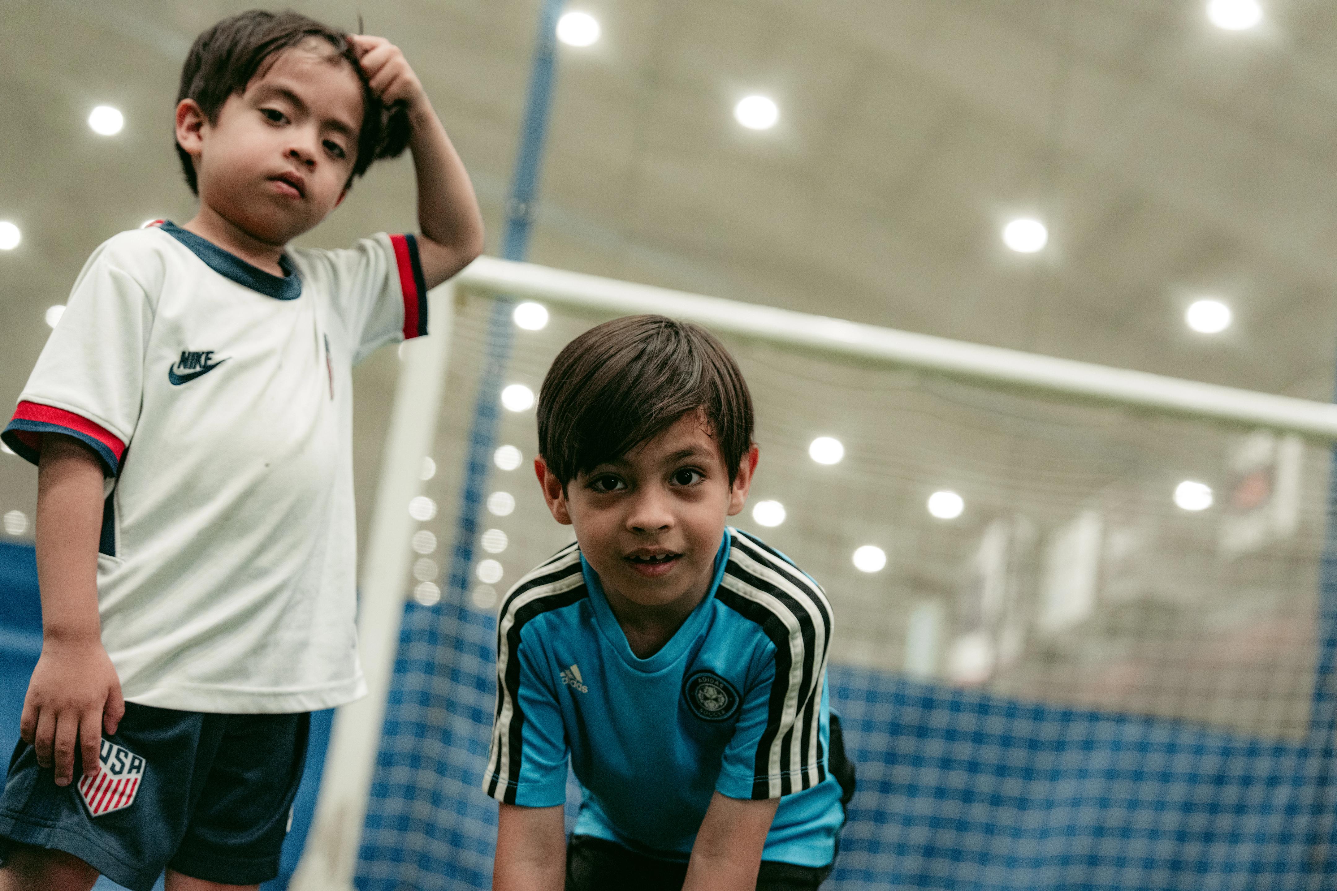 two boys on a soccer field