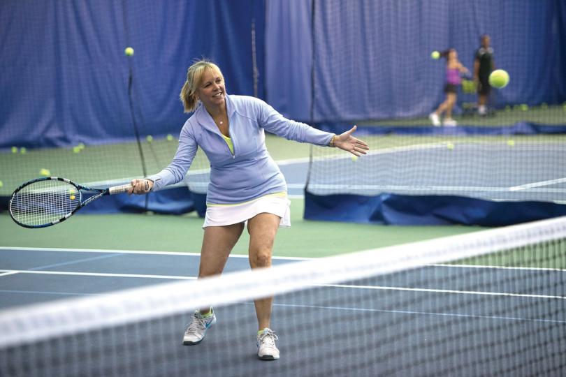 Adult playing tennis