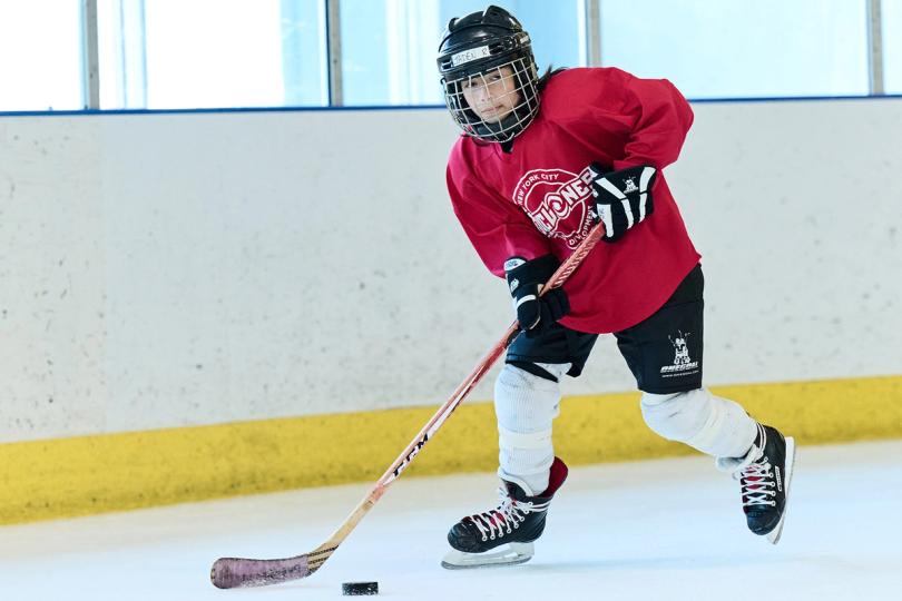 Kid playing hockey