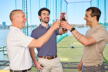 Guys hanging out at the driving range