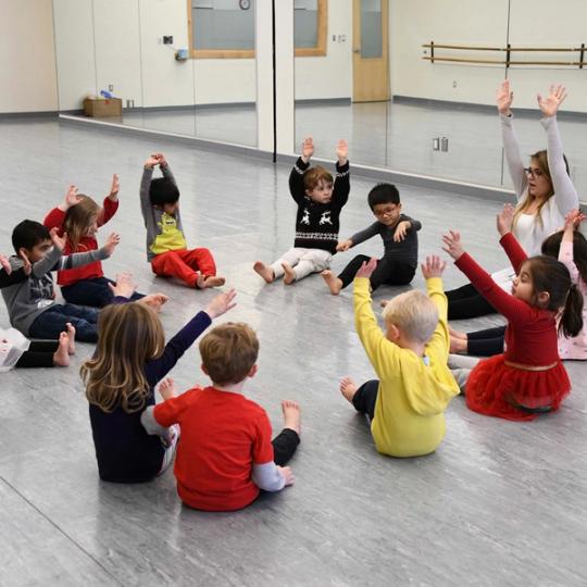 Kids doing exercises with teacher